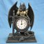 Černý bojový drak s hodinami - fantasy soška